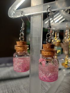 Gorgeous handmade earrings that will give just the right amount of wow-factor. Every stone, jar, flower, herb,  or any ingredient is always cleansed before assembling. A clear mind and positive intentions fill the space while building. Fairy Jar Earrings, Handmade Pink Fantasy Jewelry, Magical Handmade Dangle Earrings, Handmade Magical Dangle Earrings, Fantasy Style Drop Earrings Jewelry Gift, Fantasy Style Drop Earrings For Gift, Nickel-free Magical Earrings For Gift, Magical Nickel-free Earrings For Gifts, Unique Crystal Earrings As Gift