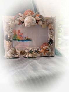 there is a frame made out of seashells