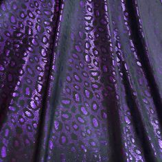 purple and black leopard print fabric with metallic foil on the bottom, it is very shiny