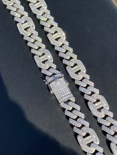 Men's prong cuban with gucci links
We have it from 18" to 30" so wear as a mens choker or as a longer bust down link
 
Heavy 150-250 grams depending on length!
15.5mm wide so it’s a thick yet not too gaudy
 
80ct man made diamonds
Gorgeous baguette & round stones 
You can’t tell difference from natural diamonds without a microscope 
Super ICY you have to see to believe!!
 
Solid 925 silver
Will never turn!! This is SOLID silver! Great Luxury Cuban Link Silver Chain Necklace, Luxury Cuban Link Silver Necklace, Luxury Silver Jewelry For Streetwear, Designer Iced Out Jewelry For Formal Occasions, Luxury Sterling Silver Cuban Link Necklace, Streetwear Jewelry With Box Chain And Cuban Link, Luxury Cuban Link Necklace With Figaro Chain, Figaro Chain Link Jewelry For Streetwear, Classic Cuban Link Iced Out Jewelry