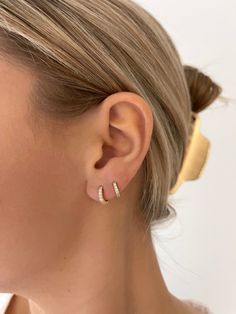 Our best selling cz huggies are perfect for everyday wear! Model wearing size medium & small Small, Medium, or Large Nickel free Cheap Nickel-free Huggie Earrings As Gift, 2nd Ear Piercing, Double Lobe Piercing, Lobe Piercing, Puffed Heart, Chain Extenders, Huggie Earrings, Itty Bitty, Earrings Set