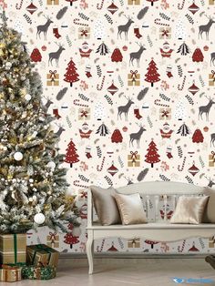 a decorated christmas tree in front of a wall with reindeers and trees on it