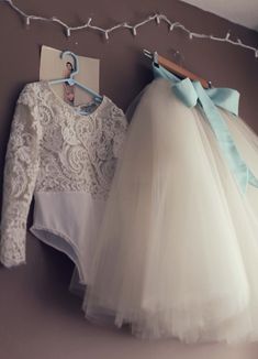 "This handcrafted flower girl dress is a top selling lace design! The listing is for both the 5320 Lace bodysuit and ivory tulle skirt (skirt hem hits just at knee or just below the knee). Read the skirt lengths for each size below.      If you want to be sure the dress fits well, please send Mary Grace the girl's measurements shortly after you place your order. Measurements needed: Waist, chest, girth, top center shoulder to waist, and top center shoulder to knee. Click here to see Anagrassia S Fitted Long Sleeve Tulle Tutu Dress, Fitted Tulle Skirt For Dress-up, Fitted Tutu Dress With Lace Bodice For First Communion, Fitted Lace Bodice Tutu Dress For First Communion, Fitted Lace Bodice Tutu Dress For Parties, Fitted Tutu Dress With Lace Patchwork For Dress-up, Fitted Lace Patchwork Tutu Dress For Dress-up, Fitted Tulle Dress For Baptism, Fitted Tulle Skirt Dress For Baptism