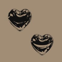 two black and white hearts on a brown background