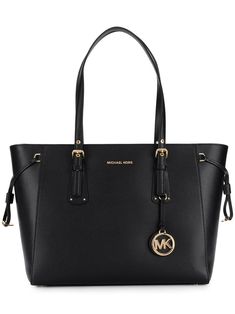 Combining elements of classic and contemporary design, Michael Michael Kors is the go-to label for clean-cut shapes and ultra-chic details. Case in point: this black leather Voyager tote. Equal parts polished and practical, the streamlined silhouette boasts a top zip fastening, a main internal compartment and multiple internal pockets for neat organization, plus delicate gold-tone hardware, a front logo plaque and a playful logo charm to finish. Swing it over your shoulder or slip it into the cr Sac Michael Kors, Handbags For School, Michael Kors Tote Bags, Girly Bags, Fancy Bags, Iconic Bags, Purses Michael Kors, Handbags Michael Kors, Women Accessories Bags