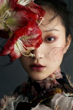 a woman with flowers on her head and the words alive in jaf written below