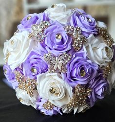 a bridal bouquet with purple and white flowers