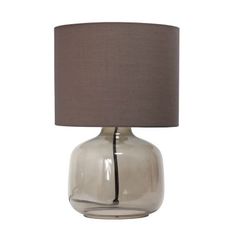 a table lamp with a grey shade on it