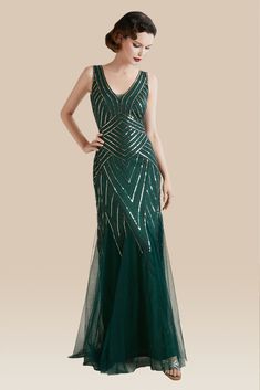 This elegant dress is classic vintage look for a modern woman. The eyecatching design features art deco print and unique vintage style which bring you back to the roaring twenties. Features: V neck design Sleeveless design Mermaid dress hemline A dazzling array of sequins Gatsby Dresses, Great Gatsby Dresses, 1920s Dresses, Mermaid Maxi Dress, Feather Headpiece, Gatsby Dress, White Peacock, 1920s Dress, Roaring Twenties