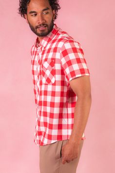 Introducing the Men's James Shirt in Red Gingham! Crafted from bold red & white large gingham print fabric, this shirt is sure to turn heads at any summer soiree. The collar neckline adds a dash of sophistication, while the sleeves ensure a polished look. With its classic button-up style, the James Shirt effortlessly blends timeless charm with summer flair, making it the perfect choice for celebrating in style this summer. Don't forget matching styles for the WHOLE family! Fitted Red Short Sleeve Shirt For Summer, Summer Casual Plaid Shirt, Gingham Cotton Short Sleeve Tops, Casual Red Top For Picnic, Red Collared Short Sleeve Shirt For Summer, Red Relaxed Fit Shirt For Summer, Casual Red Short Sleeve Shirt For Spring, Plaid Short Sleeve Summer Shirt, Relaxed Fit Plaid Shirt For Summer