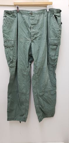 Military Style OD Green Pants/Trousers Size-Extra Extra Large Regular Wasit-43 to 47 inches Inseam-29.5 to 32.5 inches Condition-USED in GOOD shape-see pics 100% Cotton NOT MILITARY ISSUED Made in the USA!! check us out at www.armysurpluswarehouselexington.com Utility Full Length Pants With Button Closure, Military Style Green Full Length Bottoms, Green Military Style Full Length Bottoms, Green Chinos With Pockets, Green Full-length Chinos With Pockets, Green Full Length Chinos With Pockets, Army Surplus, Gore Tex Jacket, Lexington Ky