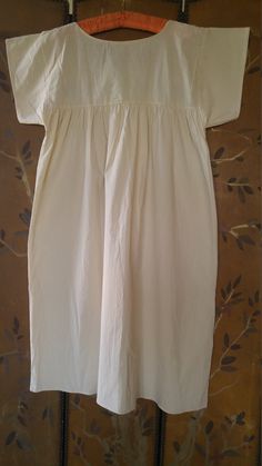 "80s cream cotton boho hippie peasant dress. Embroidered flowers down front panel and across top. Ribbon trim around panel and across top. Crochet neck. Short wide sleeves. Can be worn with a belt or open free style. Arm pit to arm pit 21\" ( up to 42 bust) across middle of dress 30\", length 43\", across shoulders 17\"" Hippie Dress, Hippie Dresses, Free Style, Peasant Dress, Pink Suede, Ribbon Trim, Wide Sleeves, Sheer Sleeves, Boho Hippie