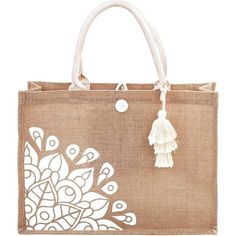 a jute bag with white designs and tassels on the handles is shown