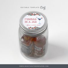 a glass jar filled with candy sitting on top of a table