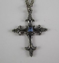 This ornate detailed cross pendant necklace touches on old world beauty and charm. Pewter is a very durable metal and should last decades. The chain is figaro style- 24 inches long . Cross pendant is  1 3/4" tall x 1 1/4" wide. Overall excellent vintage condition. Vintage Metal Cross Pendant Necklace, Vintage Metal Crucifix Cross Necklace, Vintage Cross Shaped Metal Jewelry, Vintage Cross Necklace In Metal, Vintage Nickel-free Cross Necklace, Vintage Cross-shaped Metal Jewelry, Vintage Antique Silver Cross Necklace, Vintage Metal Crucifix Necklace, Vintage Metal Cross Necklace