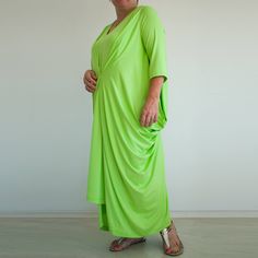 "Oversized draped maxi dress. Relaxed fit. Interesting design. Long sleeves Perfect for plus sizes The color on the photos is Apple Green color from our color chart. The model is 155cm tall and size L/XL. The dress has 3/4 sleeves. The dress is made to order. It can be made in all sizes, including plus sizes. I will need the length from the shoulder to the bottom hem or your total height. -------------------------- This garment is available in XS-3XL sizes Every garment is made for 170 cm (5\"8' Spring Lagenlook Flowy Maxi Dress, Flowy Lagenlook Maxi Dress, Summer Lagenlook Long Sleeve Maxi Dress, Spring Lagenlook Maxi Dress, Oversized Lagenlook Maxi Dress For Spring, Beach Lagenlook Maxi Dress, Oversized Linen Maxi Dress For Spring, Flowy Long Lagenlook Maxi Dress, Oversized Lagenlook Maxi Dress