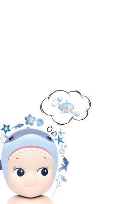 a small doll with headphones on sitting in front of a cloud filled with stars