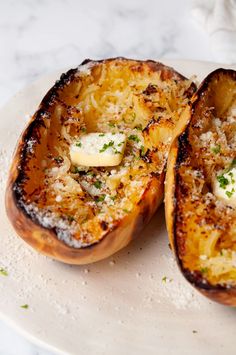 baked potatoes with cheese and herbs on a plate