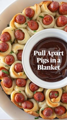 a white plate topped with pigs in a blanket