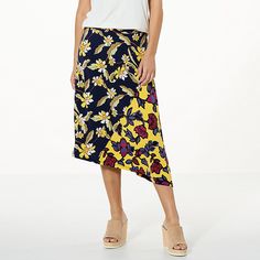 IMAN Global Chic Runway Jersey Mixed Printed Asymmetric Skirt Look fabulous when wearing this chic and elegant mixed print skirt. The fun asymmetric hemline makes a bold statement without saying a word. Chic Blue High-low Hem Skirt, Asymmetrical Floral Print Flowy Wrap Skirt, Floral Print Flowy Asymmetrical Wrap Skirt, Flowy Asymmetrical Wrap Skirt With Floral Print, Spring Handkerchief Hem Wrap Skirt, Summer Floral Print Skirt With Asymmetrical Hem, Asymmetrical Hem Floral Print Skirt, Floral Print Flowy Skirt With Asymmetrical Hem, Flowy Floral Print Skirt With Asymmetrical Hem