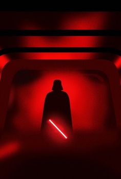 a red light in the dark with a darth vader silhouette