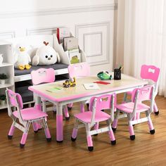 a child's table and chairs in a room