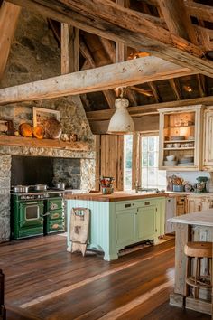 an old fashioned kitchen with wood floors and exposed beams on the ceiling is very rustic