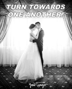 a bride and groom standing in front of a window with the words turn towards one another