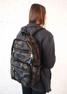 Our Camo Backpack is a full size bag boasting exceptional quality. This backpack was designed using both comfortability and sturdiness in its construction. The resilient nylon material and customizable shoulder straps make this an ideal bag for traversing with comfort and confidence. Equipped with a padded back panel and adjustable waist strap, you can be sure of comfortable protection and support with every use. Enjoy reliable protection with the Duraflex® clip buckles that will hold up no matt Nylon Backpack With Adjustable Straps, Sporty Nylon Backpack With Multiple Pockets, Sporty Backpack With Multiple Pockets, Sporty Standard Backpack With Multiple Pockets, Nylon Backpack With Multiple Pockets, Nylon Standard Backpack With Multiple Pockets, Nylon Backpack With Multiple Pockets For Everyday Use, Nylon Commuter Bag With Multiple Pockets, Nylon Commuting Bag With Multiple Pockets