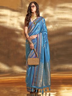 Elevate your traditional look with our beautiful blue zari weaving satin wedding wear saree with blouse. The stunning blue color and intricate zari weaving work make this saree perfect for weddings, festivals, and other special occasions. Made from comfortable satin material, the 5.50 meters saree drapes beautifully, while the matching silk blouse adds an extra touch of elegance.
The saree has a beautiful color that is elevated by the amazing weaving work, creating a stunning and elegant ensembl Saree Drapes, Floral Print Sarees, Bridesmaid Saree, Purple Saree, Ethnic Wear For Women, Ready To Wear Saree, Satin Saree, Blue Saree, Trendy Sarees