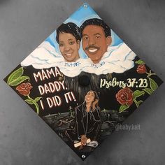 a decorated graduation cap with an image of two people on it and the words mamma daddy, i did it