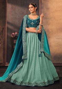 Chinon a line lehenga choli in Turquoise colour 505  Desc:  Style : A Line Lehenga Choli Color : Teal   Turquoise Fabric : Chinon Work : Embroidery Wash Care : Dry clean Sleeve Style : Half Sleeve Long Sleeves : Done only in Custom Stitch Sleeves Lining : Done only in Custom Stitch Bust Size : 32 to 42 Inches Occasion : Wedding   Mehendi   Sangeet   Engagement   Reception   Ceremonial   Baby Shower. With Express Free Shipping and Custom Stitching, Buy Indian Party wedding wear bridal Lehenga Chi Chiffon Lehenga, Lehenga Choli For Wedding, Choli For Wedding, A Line Lehenga, Indian Wedding Sangeet, Heavy Lehenga, Bridal Lehenga Online, Indian Wedding Sarees, Organza Lehenga