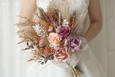 a bride holding a bouquet of flowers in her hands