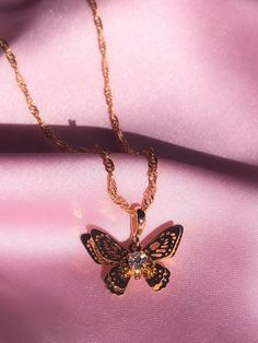 ✨ITEM DETAILS✨The sweetest butterfly necklace featuring a cute cubic zircon diamond. 18K Gold plated. You can pair it with our matching Mariposa hoops! ✧Chain length: 45 cm waterwave chain✧Pendant size: 2cm*1.3cm✧18K Gold plated pendant✧Gold filled chain✧Lead and Nickel free✨SHIPPING✨✧ UNITED STATES: Free Tracked Shipping✧ CANADA:  Free Untracked Shipping. You can upgrade to tracking                        at checkout.✧ INTERNATIONAL: $8.50 Tracked shipping Gold Jewelry With Butterfly Charm For Party, Dainty Butterfly Necklace For Party, Dainty Butterfly Charm Necklace For Party, Dainty Gold Plated Butterfly Jewelry, Gold Butterfly Necklace With Delicate Chain For Party, Gold Butterfly Necklace For Party, Gold Cubic Zirconia Butterfly Necklace With Clavicle Chain, Gold Butterfly Charm Jewelry For Party, Yellow Gold Butterfly Jewelry For Party