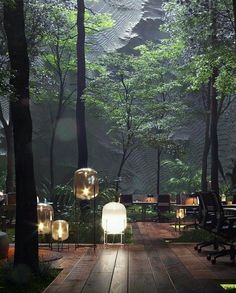 an outdoor area with tables, chairs and lights