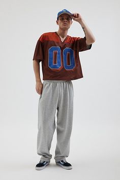 Mesh football jersey by Urban Outfitters. Semi sheer short sleeve t-shirt with a number graphic at the front. Boxy fit tee in a cropped length. Features UO football v-neck jersey Mesh football jersey tee Two-tone V-neck Short sleeve Number graphic Sheer mesh Short sleeve Boxy fit Cropped length Content + Care 100% Polyester Machine wash Imported Size + Fit Model in Green is 6’2.5" and wearing size Medium Measurements taken from size Medium Chest: 46" Length: 23.5" | Urban Outfitters UO Mesh Foot Casual Jersey T-shirt For Game Day, Football Season Short Sleeve Streetwear T-shirt, Sportswear Crew Neck T-shirt For Football Season, Sporty Short Sleeve T-shirt For Football Season, Sportswear T-shirt With Team Name For Football Season, Sportswear Cropped T-shirt With Short Sleeves For Sports, Sportswear Cropped T-shirt With Short Sleeves, Urban Outfitters Sporty Cotton T-shirt, Football Season Sportswear T-shirt With Letter Print