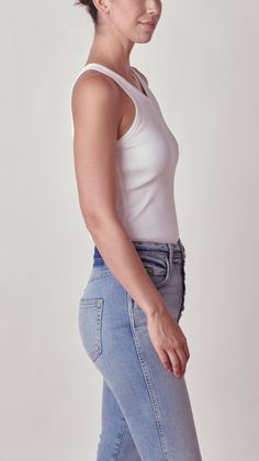 Description The Long Rib Tank Body Suit in White by Amo Denim is made from our original, custom rib fabric in a sleek, comfortable silhouette. With snap enclosures, this bodysuit can be styled with a high waisted denim for a casual weekend look. 100% mid-weight cotton. Machine wash cold. Measurements Taken from a size small 22 3/4" in length from the shoulder Tank Bodysuit, Rib Fabric, Casual Weekend, Body Suit, High Waisted Denim, Thom Browne, Ribbed Fabric, Denim Top, Victoria Beckham