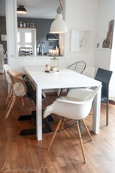 a white table and chairs in a room