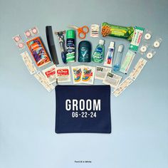 an assortment of grooming products laid out on top of a blue towel with the word groom written across it