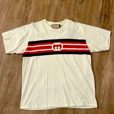 Gucci Logo Stripe T Shirt Size Medium New With Tags Gucci Cotton Graphic Tee, Gucci Casual T-shirt With Letter Print, Gucci Cotton T-shirt With Logo Print, Gucci White Graphic T-shirt, Gucci Shirts, Luxury Gucci Men's T-shirt, Tags, Man Shop, Gucci