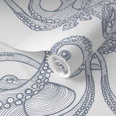 an octopus wallpaper in blue and white with intricate designs on the back side of it