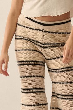 Striped crochet-knit sweater pants. Banded elastic waist. Wide leg. Thigh-length shorts lining. Relaxed fit. 55% Acrylic, 45% Cotton. Imported. Designed in LA. Model wears size S. Casual Open Knit Loungewear Bottoms, Beige Stretch Knit Bottoms, Summer Stretch Pointelle Knit Bottoms, Stretch Beige Knit Bottoms, Chic Cream Knit Bottoms, Beige Knit Beach Bottoms, Beach Knit Beige Bottoms, Beige Crochet Trim Bottoms For Spring, Beige Bottoms With Crochet Trim For Spring