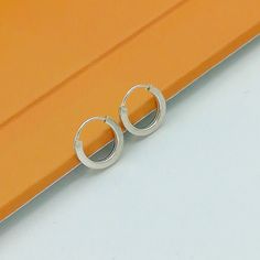 IMPORTANT **Please go through all the pictures i have posted for a listing with a ruler, on a model, on my hand, to get an exact idea of the actual size of the item. Sterling silver 10mm huggie ear hoops. Dimensions: 1.2 x 10mm Price listed is for a PAIR of hoops. These earrings are made of 925 hypoallergenic sterling silver. Most of my pieces come with a 925 stamp. Can be packaged in a gift box. I can include a personal message from you if needed You are welcome to contact me at... bhavnakwintr Earrings Small Hoops, Small Silver Hoop Earrings, Wanderlust Jewelry, Hoops Silver, Jewelry Minimalist, Tiny Star, Silver Jewels, Ethnic Earrings, Skull Earrings