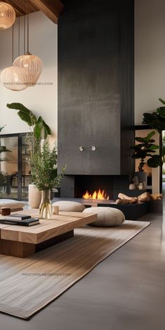 a living room with a fire place and couches in front of a wall mounted fireplace