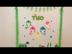 there are some decorations on the wall with fish and sea animals in it, as well as letters that spell out one