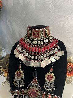 Exquisite Afghan Jewelry Set - Perfect for Special Occasions🇦🇫 Add a touch of exotic elegance to your look with our stunning Afghan jewelry set. Handcrafted by skilled artisans, each piece is a unique work of art that captures the rich cultural heritage of Afghanistan. This set includes a dazzling necklace, matching earrings, and a Tikka headpiece, all intricately designed with traditional Afghan motifs and embellished with vibrant TURQUOISE gemstones. Festive Bohemian Turquoise Jewelry, Traditional Turquoise Jewelry For Ceremonial Occasions, Silver Beaded Jewelry For Festivals, Silver Beaded Festival Jewelry, Intricate Design Jewelry For Festival, Bohemian Round Bridal Necklace As Gift, Bohemian Hand Set Earrings As Gift, Bohemian Hand Set Earrings For Gift, Beaded Jewelry Sets For Festivals