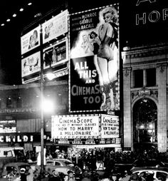 an old black and white photo of people standing in front of a building at night