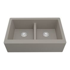 a gray double bowl sink with two faucets in the center and one side