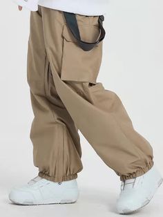 It's impossible to beat these jeans ski pants' bagginess and steezy colorways. Styled to make every fit look amazing, they’re guaranteed to be your favorite winter investment. Designed with 2 front zipper pockets, 2 back pockets, 2 cargo pockets, snow-repelling elastic cuffs and leg vents, there's no way you won’t enjoy your day in these baggy snow pants. Features Include: Waterproofing: 15K Waterproof / 10K Breathable Fabric: Polyester, OMINI-HEAT tech applied to save more heat. Fit: Baggy Insu Winter Cargo Pocket Parachute Pants For Outdoor Activities, Winter Outdoor Parachute Pants With Cargo Pockets, Winter Casual High Waist Parachute Pants, Casual High-waist Parachute Pants For Winter, Casual High Waist Parachute Pants For Winter, Baggy Utility Bottoms For Winter, Winter Functional Parachute Pants With Cargo Pockets, Functional Baggy Pants For Outdoor Activities, Urban Parachute Pants With Belt Loops For Outdoor