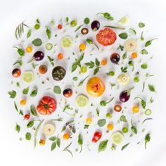 a white plate topped with lots of different types of vegetables